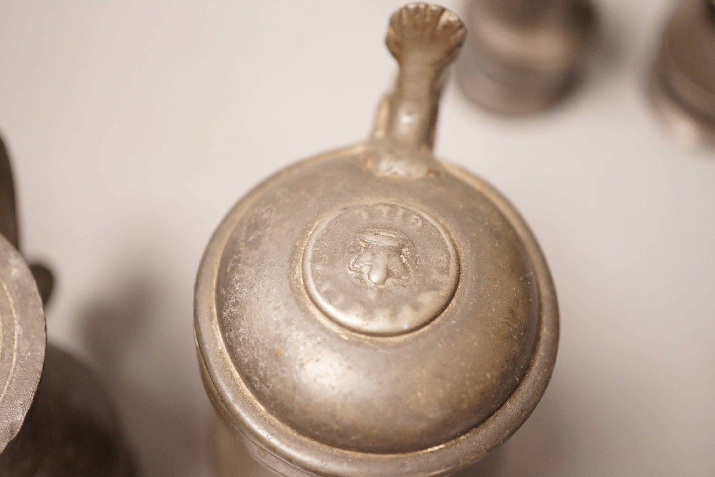 A group of 18th / 19th century pewter measures, 19cm